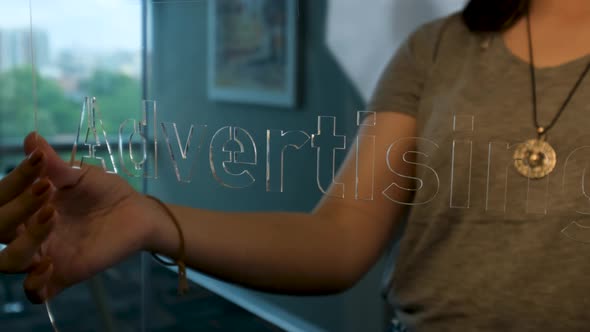 Woman Holding Glass Advertising Sign