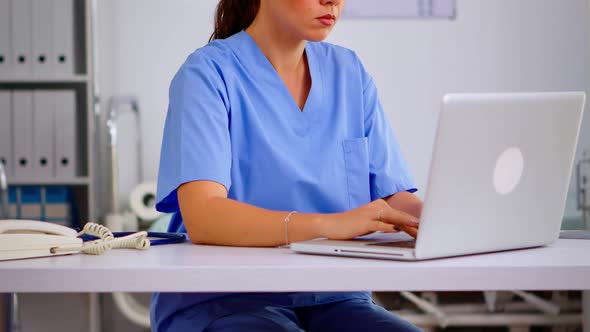 Portrait Medical Nurse in Blue Practitioner Uniform Smiling at Camera