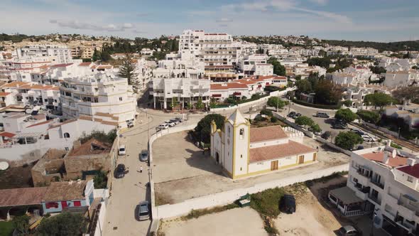 Church of Nossa Senhora da Luz surrounded by townscape, Algarve - Aerial