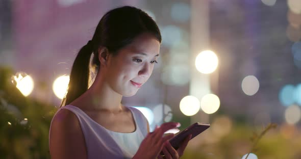 Woman Use of Mobile Phone for Online