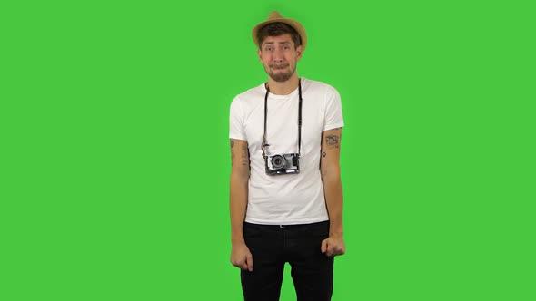 Confident Guy Is Saying Oops and Shrugging . Green Screen