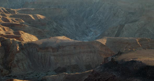 Huge steep rocky hills and cliffs of the huge Fish River Canyon, Namibia, 4k