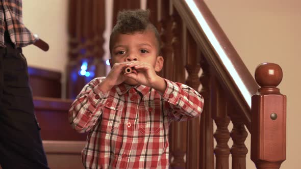 Black Boy Playing Flute.