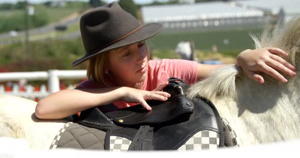 Girl petting a horse in the ranch 4k