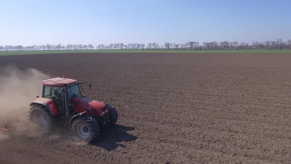 Tractor Plowing In A Field