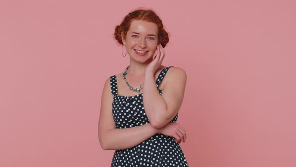 Cheerful Lovely Redheaded Young Woman Fashion Model in Dress Smiling and Looking at Camera Alone