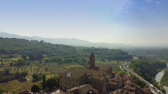 Flying Backward Over Tuscany Old Buildings in Italy