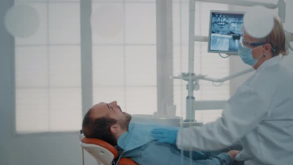 Stomatologist Woman Consulting Patient After Teeth Procedure