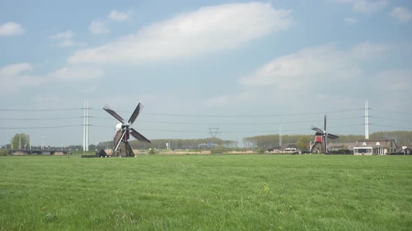 Traditional Dutch Windmill On Grassland. Rural Scenery In Leiderdorp, Leiden, Netherlands. wide