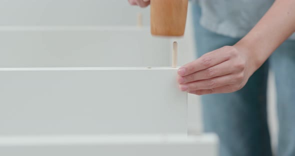 Woman assembling a shelf