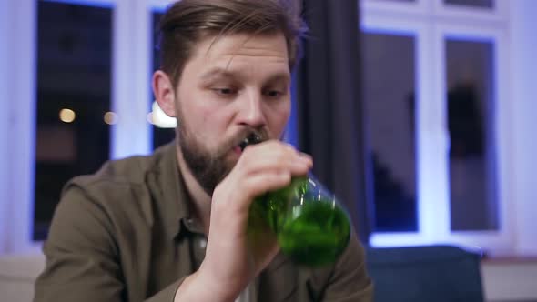 Man which Drinking Beer, Eating Chipps During Celebrating Scored Ball