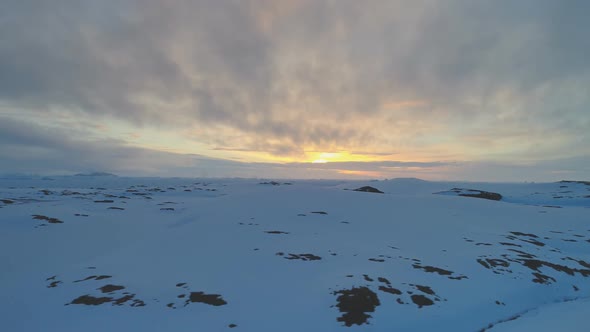 Arctic Sunset Sky Over Frozen Hill Aerial View