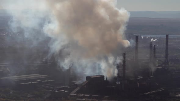 Air pollution over the city by emissions from industrial chimneys