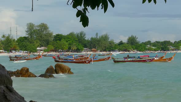 White Sandy Beach and Boats in Sea