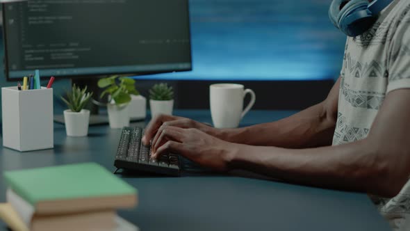 Close Up of Black Hands Coding Server Interface with Binary Codes