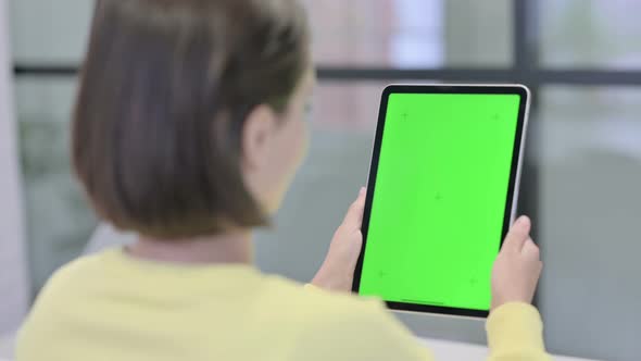 Young Woman Using Tablet with Chroma Screen