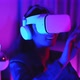 Young asian woman is using virtual reality headset. Neon light studio portrai - VideoHive Item for Sale