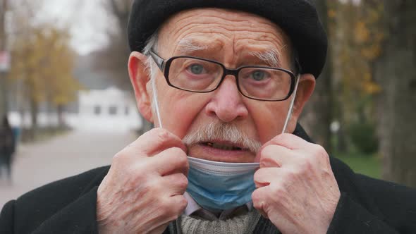 Virus mask spanish elderly senior on street wearing face protection in prevention for coronavirus co