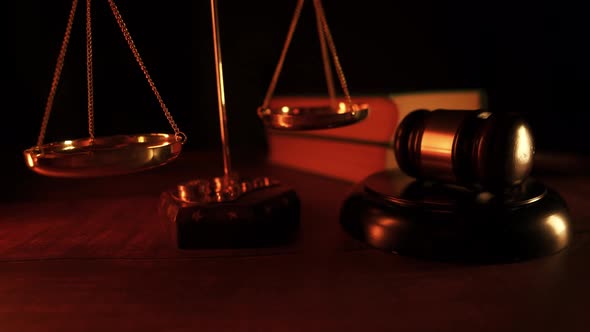 Close Up of a Vintage Judge Gavel and a Scales of Justice
