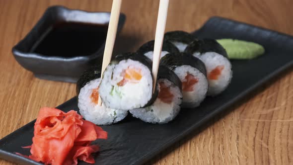 Sushi on a Wooden Table in Restaurant Delicious Japanese Food Sushi Rolls