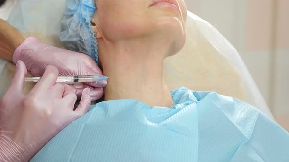 Female Patient Getting Botulinum Toxin Injections in Her Neck in Beauty Salon Beauty Clinic