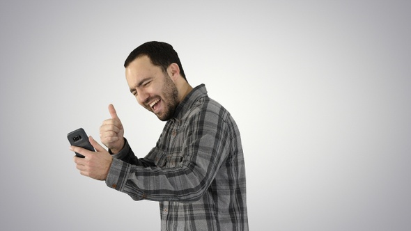 Portrait of successful handsome young man video chating