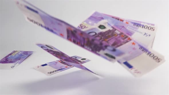 Euro Money Flying in the Air and Land on White Surface