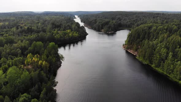 Aerial shot of Murolahti bay in Ladoga skerries, forested rocky land