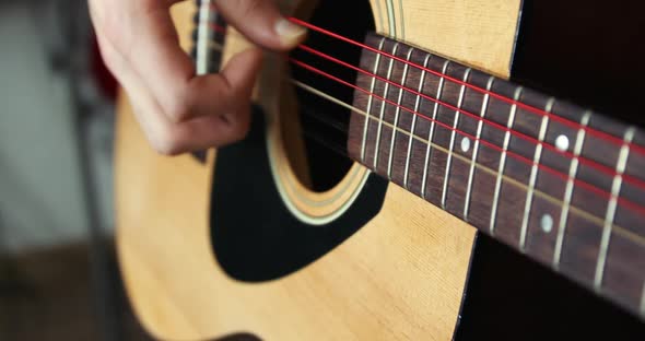 Strumming a Guitar Close Up in Super Slow Motion 300Fps