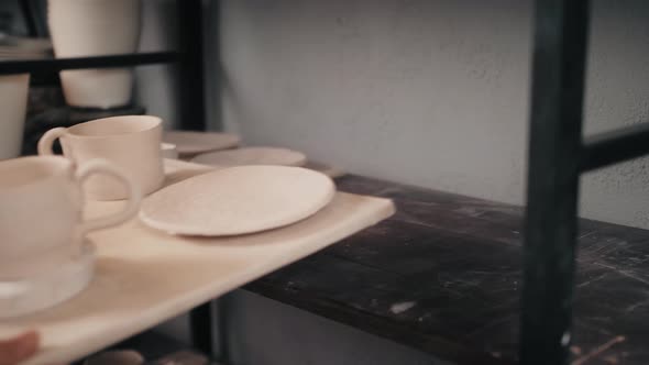 Handmade Ceramic Pottery Platet and Pots in a Potter's Workshop