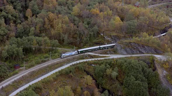 The Flam to Myrdal Train Passing Through Beautiful Landscapes