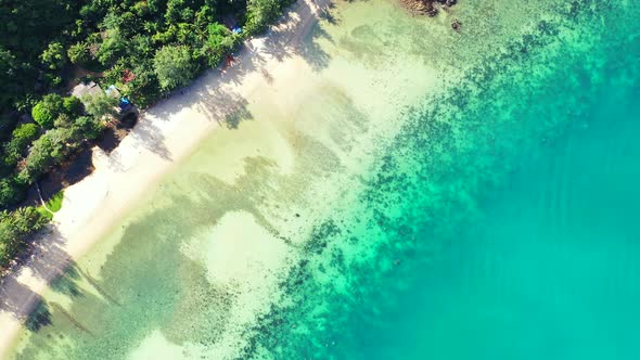 Beautiful overhead tourism shot of a summer white paradise sand beach and blue sea background in hi 