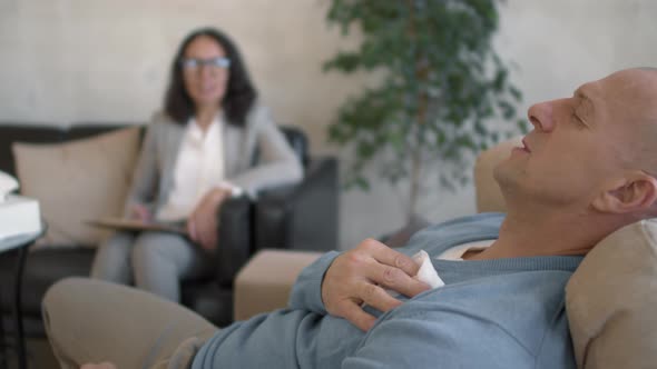 Emotional Man Sharing Problems in Therapy Session