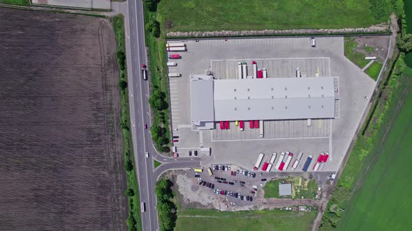 Aerial Top View of a of Semitrailer Truck Traveling Through the Parking