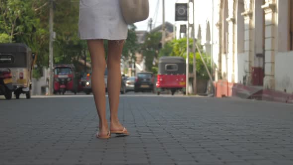 Woman Legs Walk Along Road Approaching Local Transport