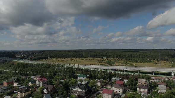 Aerial Shot of Suburban Houses Near Freeway