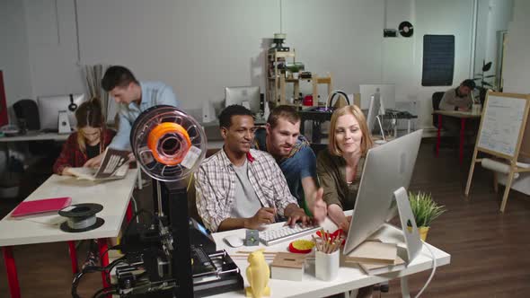 Engineers Discussing 3d Printing Project in Workshop