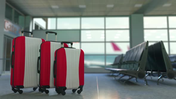 Travel Suitcases Featuring Flag of Austria in Airport