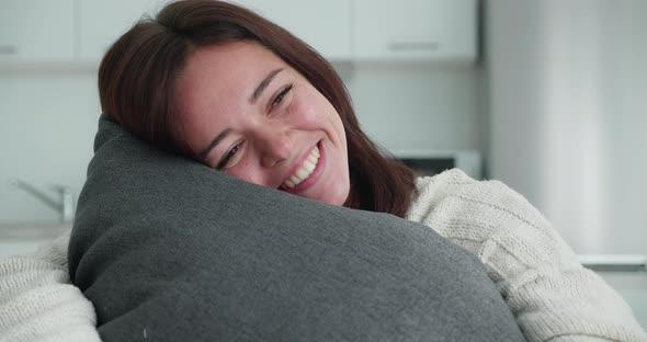 Beautiful Smillimg Women Hugging Her Pillow
