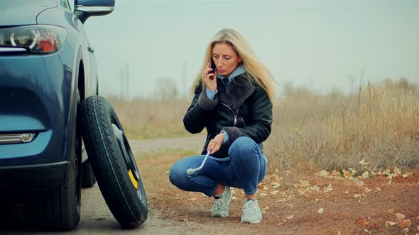 Woman Calling To Car Service. Waiting Tow-ruck Picking Up Broken Car.Driver Calling To Auto Mechanic