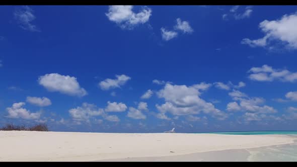 Aerial drone shot seascape of luxury shore beach holiday by turquoise ocean with white sand backgrou