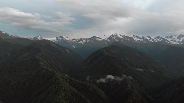 Aerial View of the Mountains Range with Clouds and Storm Clouds