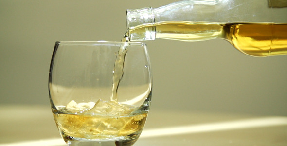 Whiskey Being Poured into Glass