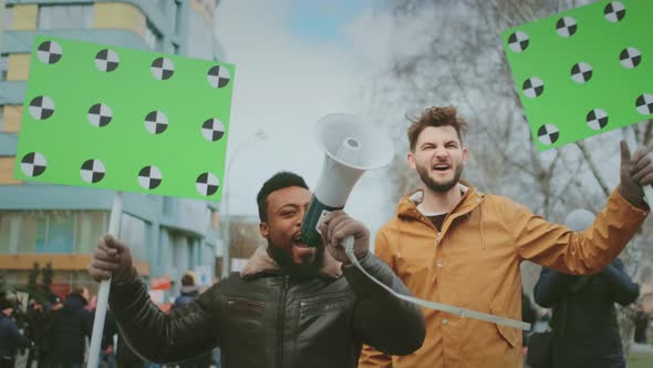 Black African with White Man with Mockup Placards and Bullhorns at Demonstration