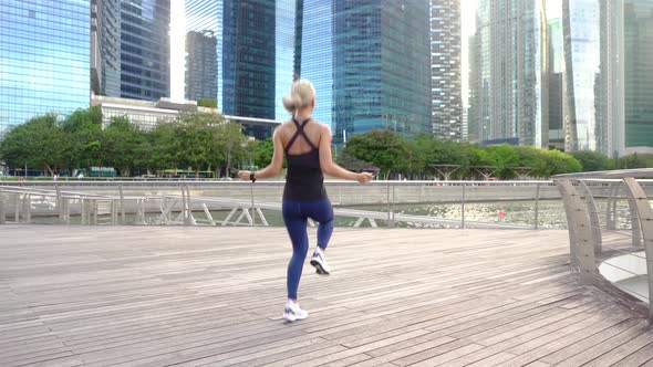 Woman doing exercise with jump rope