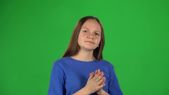 Little Female Is Clapping Her Hands. Greenscreen
