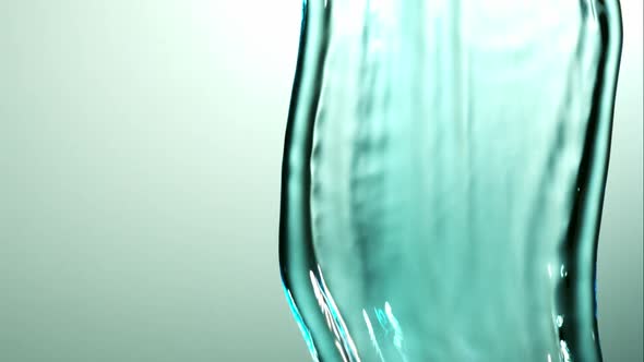 Water pouring and splashing in ultra slow motion 1500fps on a reflective surface - WATER POURS