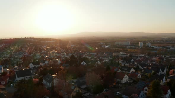 Aerial Drone View of Small Town Against Setting Sun