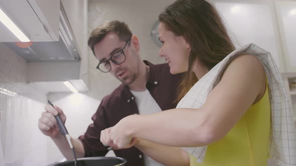 Couple Cooking Together in the Kitchen at Home