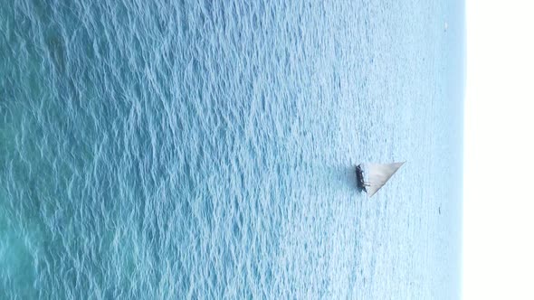 Vertical Video Boats in the Ocean Near the Coast of Zanzibar Tanzania Aerial View